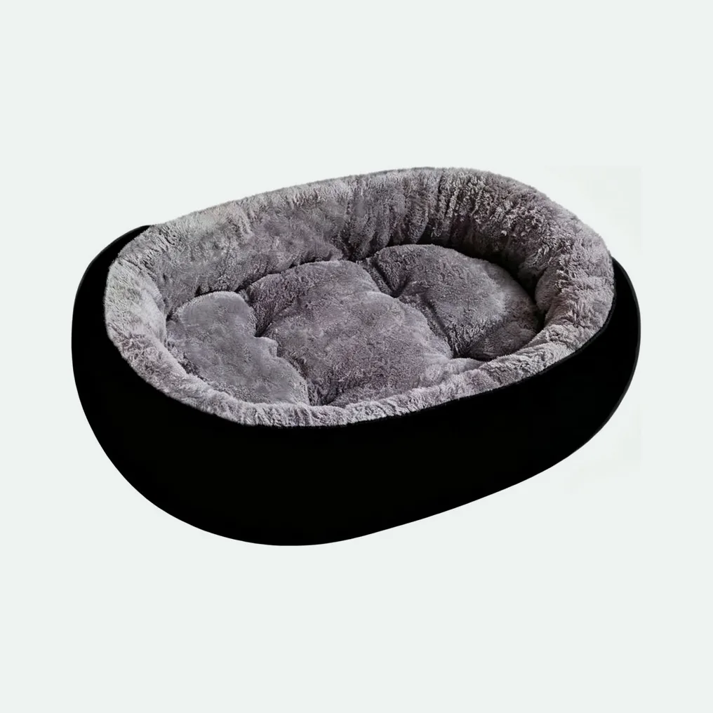 Oval dog bed with a black outer wall and a grey long-pile fleece rim and cushion
