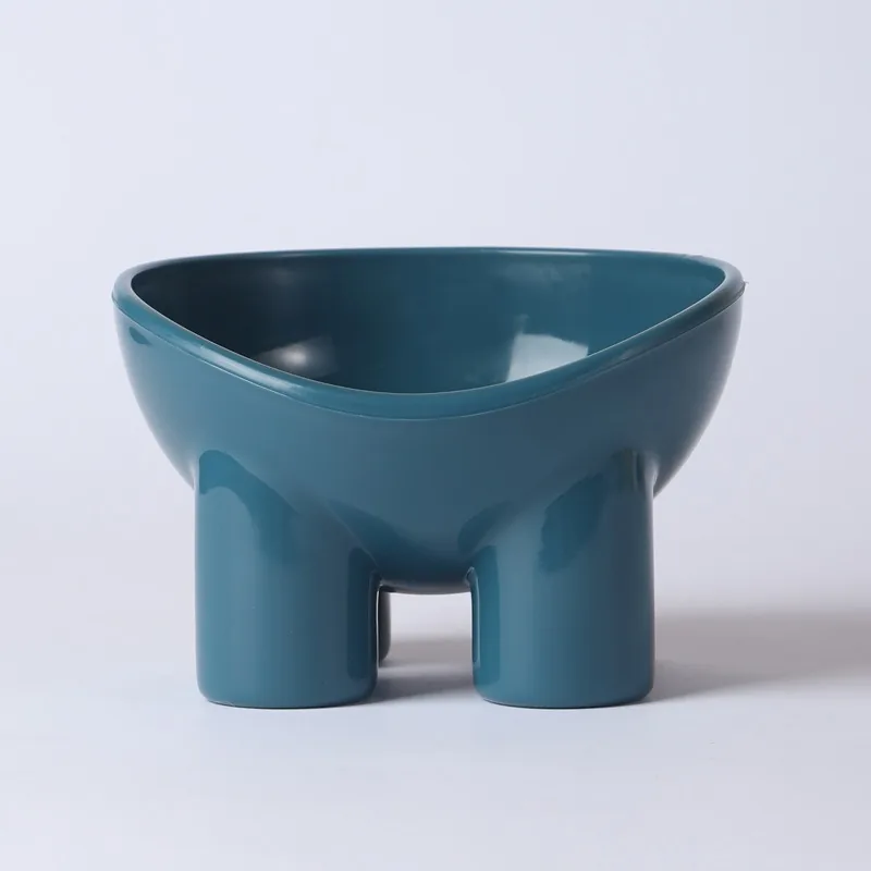 Dark blue raised plastic bowl on four short legs, with a tilted rim