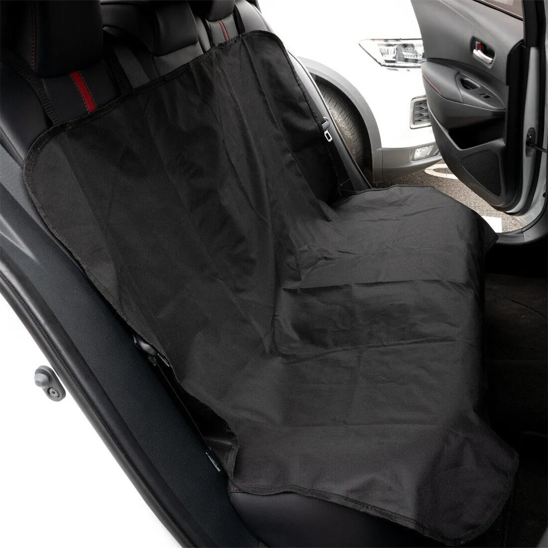 Rear seat protector mat fitted across the back seat of a car