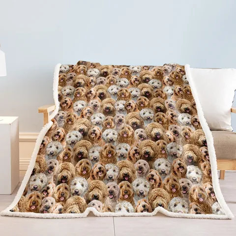 Fleece throw printed with cockapoo faces and edged with white sherpa, draped over an armchair